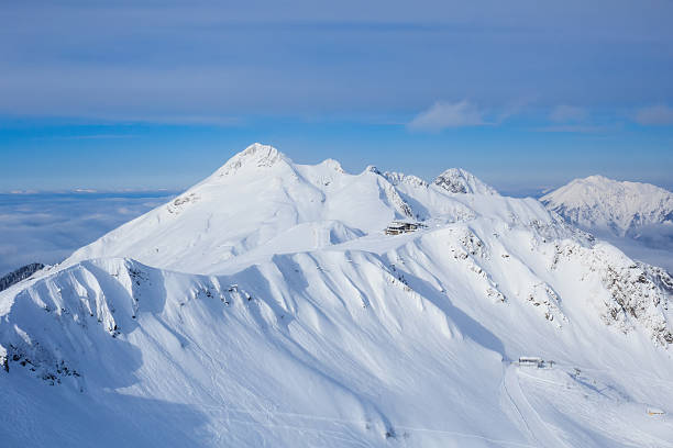 istock Lodge in mountain covered with snow in mountain ski resort 517127794
