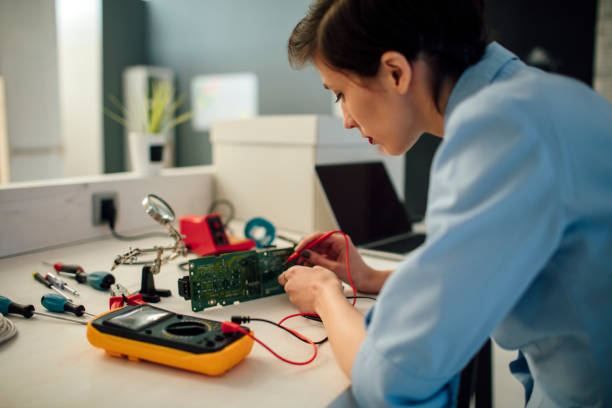istock Woman Testing circuit board in her office. 517129226