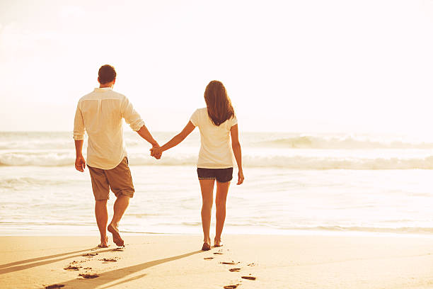 istock Romantic Couple on the Beach at Sunset. 517130170