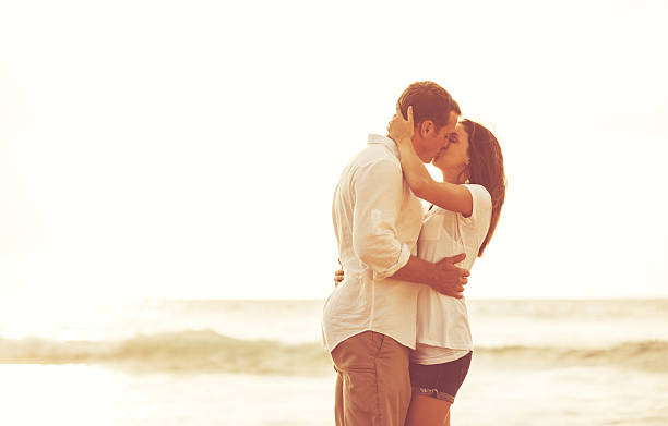 istock Romantic Couple on the Beach at Sunset. 517130358
