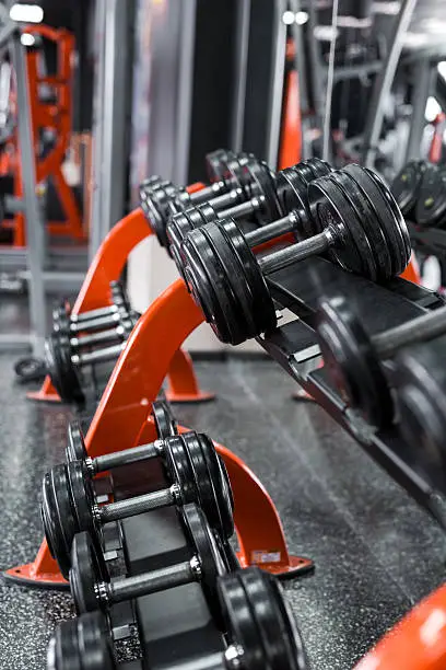 Photo of Black dumbbells in the gym