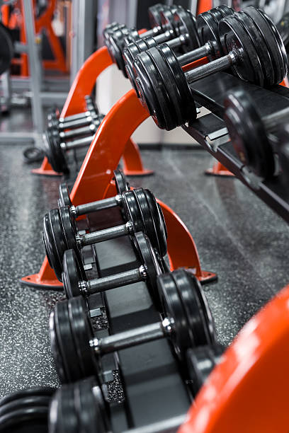 istock Black dumbbells in the gym 517131624