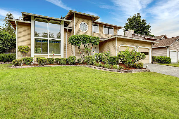 istock House exterior with large window and front yard landscape design 517132347