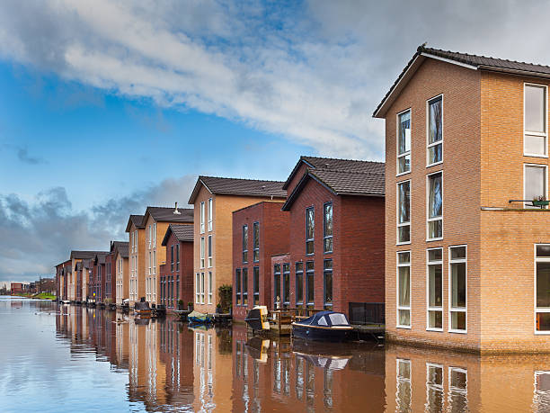 istock Modern Houses on the Water Front in a row 517132408