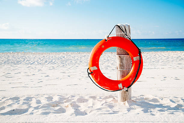 istock Life buoy on a pole on a beach in Mexico 517133270