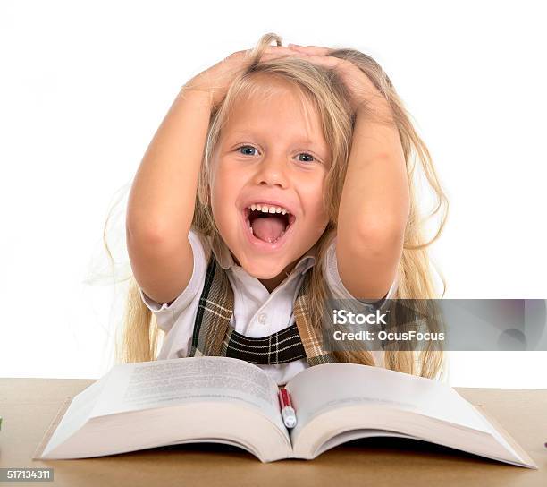 Sweet Little Schoolgirl Pulling Her Blonde Hair In Happy Stress Stock Photo - Download Image Now