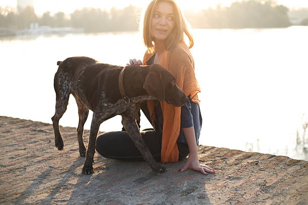 istock Girl with her dog 517134670