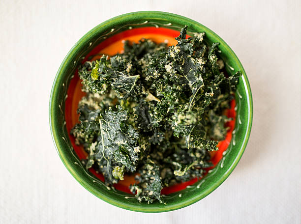 istock vegan kale chips with yeast in a green ceramic bowl 517134984