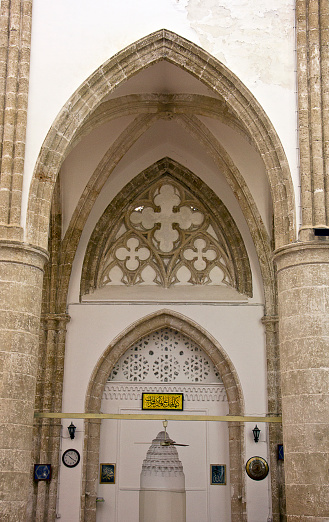 Facade of the Church of San Pablo in the Romanesque style of Úbeda, Jaén, Spain, red wooden door, columns and pointed arches