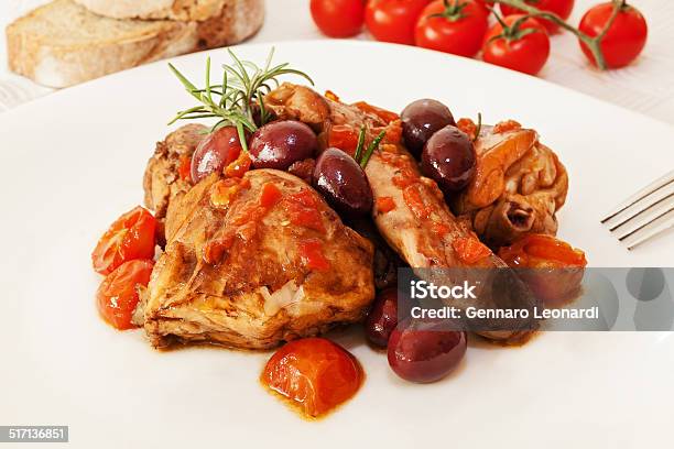 Rabbit Cooked Tomato And Olives Stock Photo - Download Image Now - Baked, Black Olive, Cooking