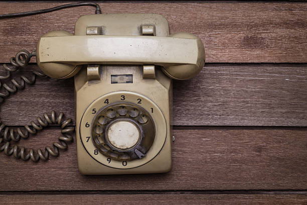 istock Vintage Telephone on an Old Wood Table 517137597
