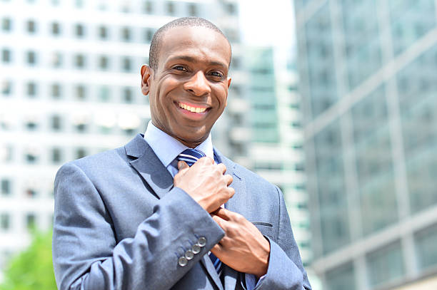 istock Businessman adjusting his collar outdoors 517148489