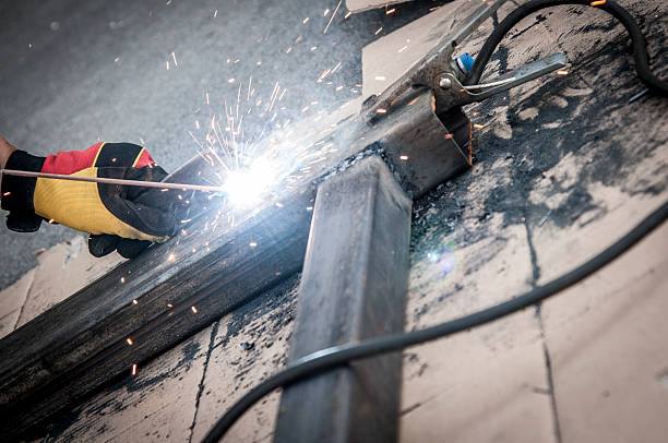 istock a metal worker in the process of welding metal 517150331
