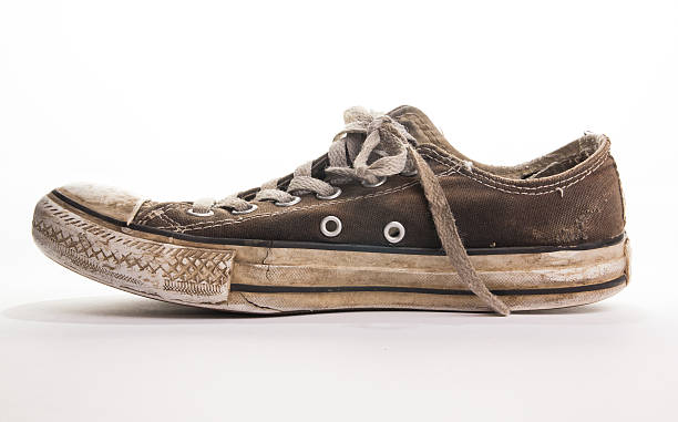 istock Dirty tennis shoe side view 517151267