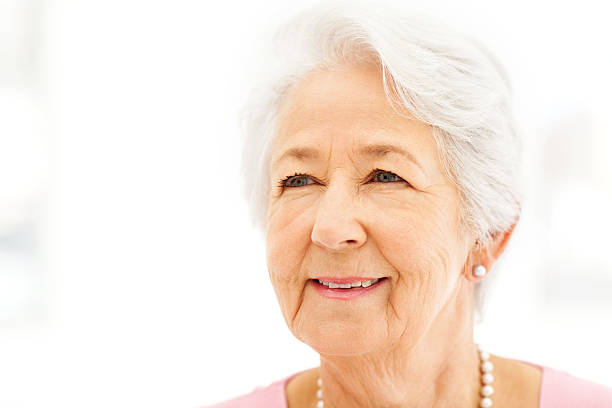 istock Senior Woman Smiling While Looking Away 517151337