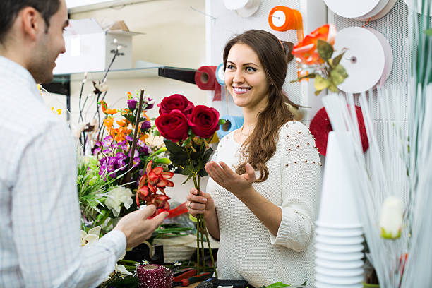 istock seller helping to pick flowers man 517151476