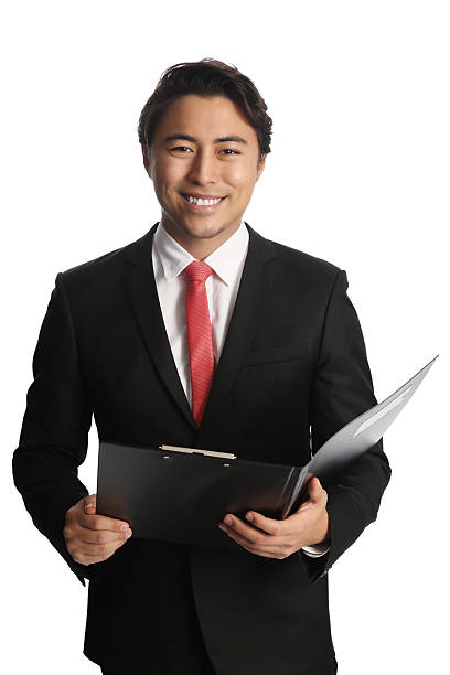 istock Attractive businessman with clipboard 517152408