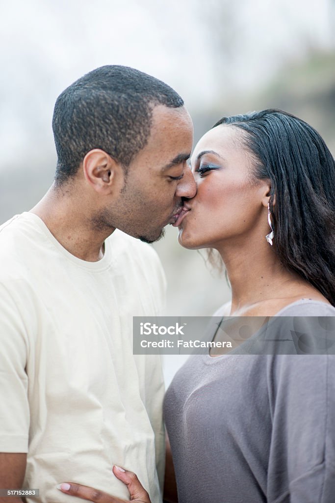 Family outside in winter A happy black family enjoying the outdoors on a foggy day. 30-39 Years Stock Photo