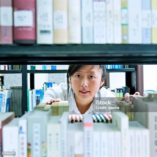 Choosing Book In Library Stock Photo - Download Image Now - Adult, Adult Student, Adults Only