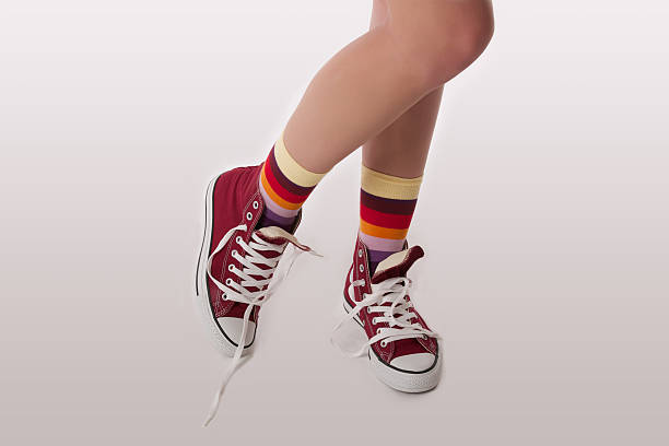 istock woman's foots in the sneakers 517155637
