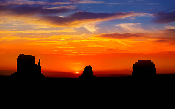 Sunrise at Monument Valley West and East Mittens Butte Sunrise at Monument Valley West and East Mittens Butte Utah National Park west mitten stock pictures, royalty-free photos & images
