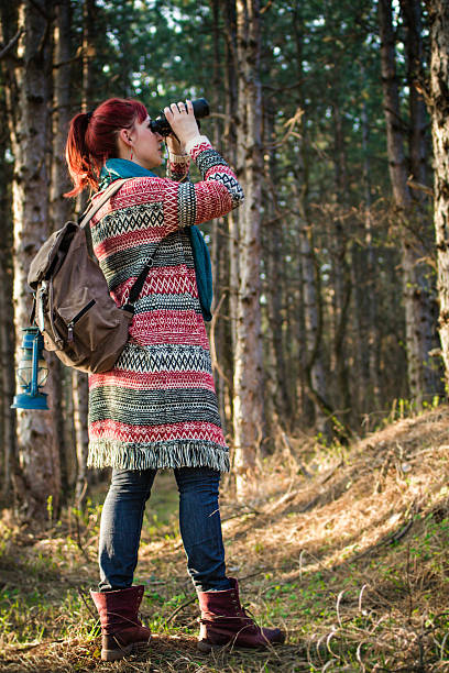 istock Female hiker walking  in the sunny mountain forest 517156550