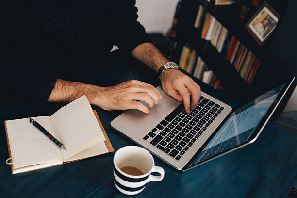 istock Young man typing at the laptop 517156630