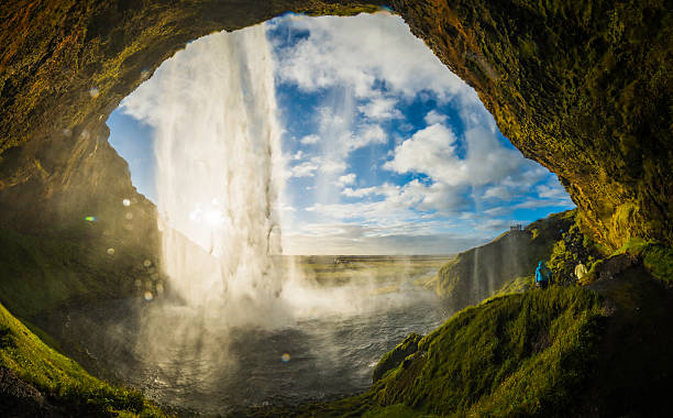istock Waterfall tumbling into river above cavern mouth Seljalandsfoss Iceland 517157114