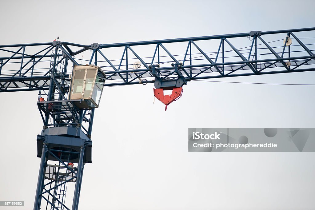 Crain Metal Construction Crain construction equipment seen in front of a grey sky. Architecture Stock Photo