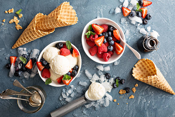 istock Vanilla ice cream scoops with berries 517161144
