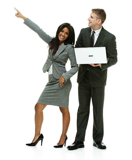 istock Business couple standing together and pointing 517161822
