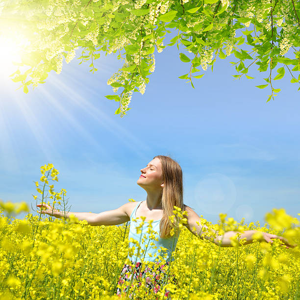 istock Young happy woman on blooming rapeseed field 517163852