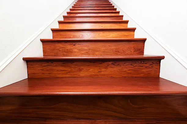 Beautiful Santos mahogany wooden stairs leading up.