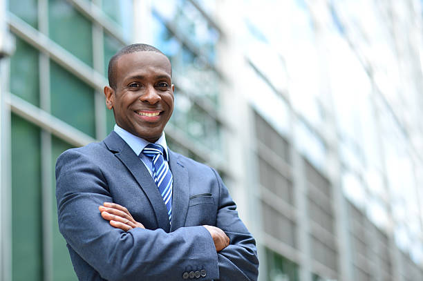 istock Handsome businessman with crossed arms 517166757