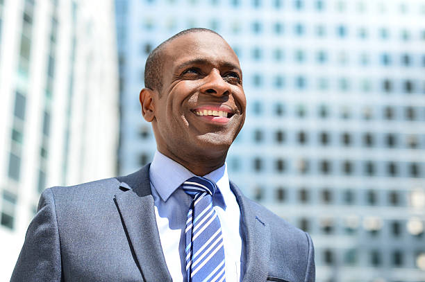istock Handsome businessman standing at outdoors 517166761