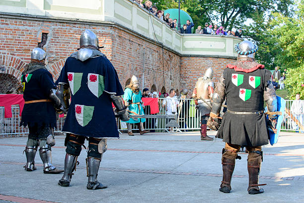 Old knights show Wroclaw, Poland - October 5, 2014: Enthusiasts of the old knights show their costumes and skills in a duel at the Cultural Center "Castle" - Lesnica in Wroclaw. bailey castle stock pictures, royalty-free photos & images