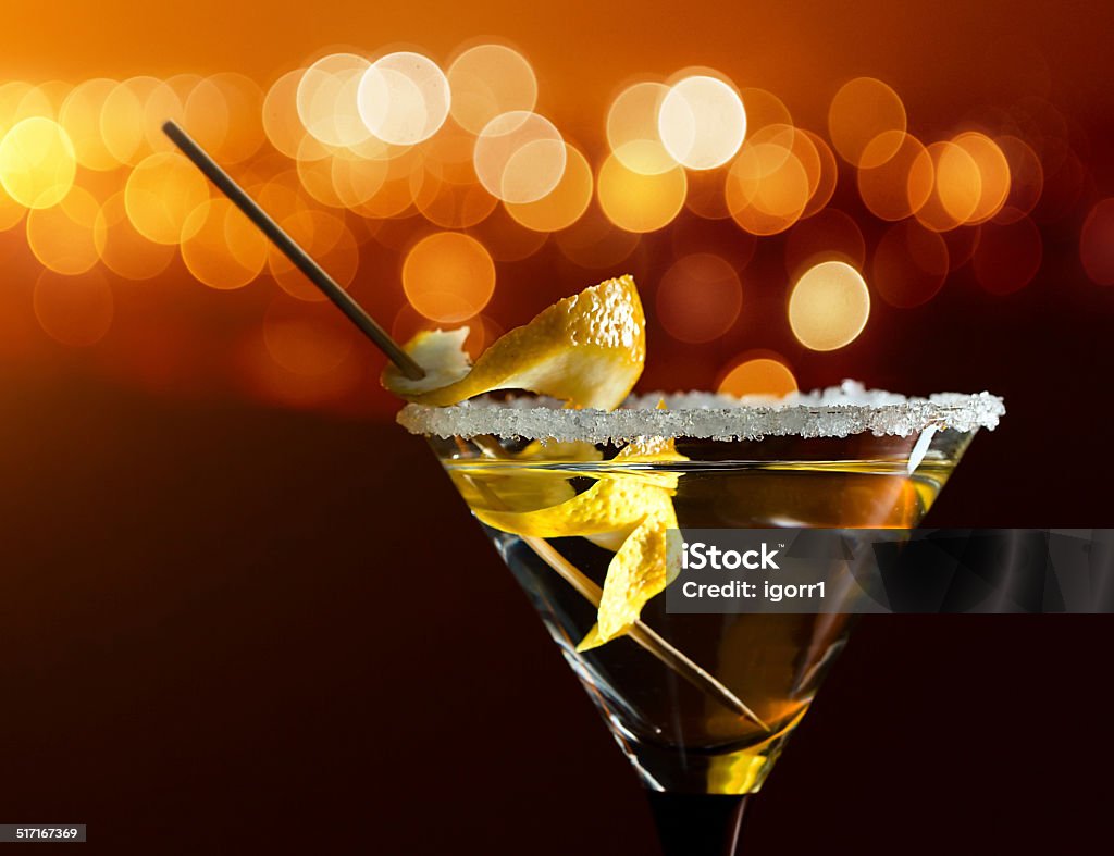 cocktail with lemon cocktail with lemon , focus on a foreground Alcohol - Drink Stock Photo