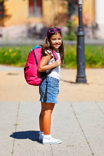 istock Beautiful young girl going to school 517168233