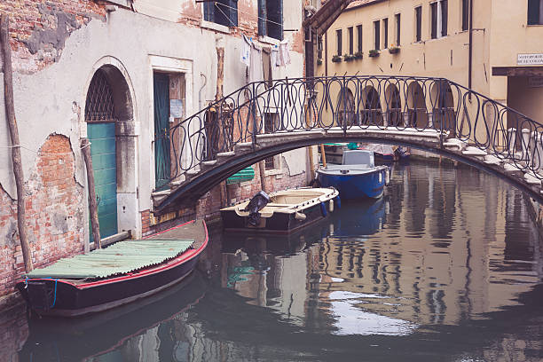 istock small bridge and architectural fragments from buildings in Venic 517169475