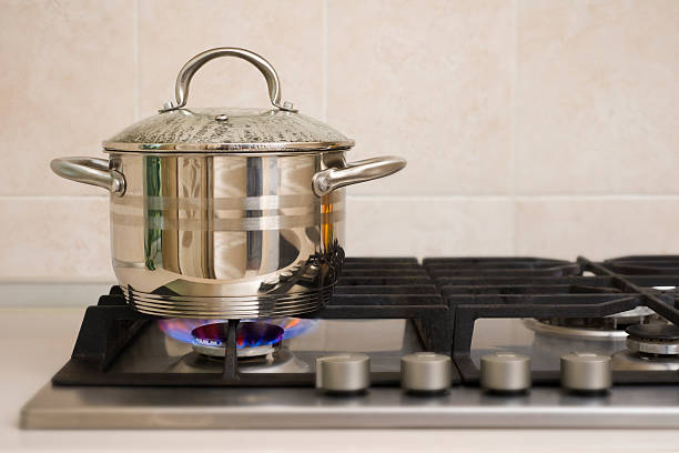 istock Boiling pot on the gas stove fire 517170169