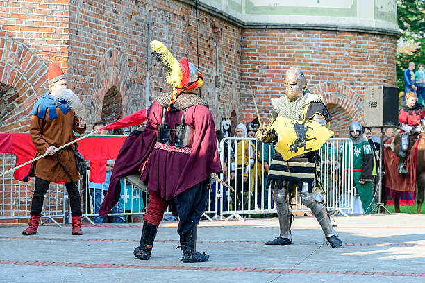 Old knights show Wroclaw, Poland - October 5, 2014: Enthusiasts of the old knights show their costumes and skills in a duel at the Cultural Center "Castle" - Lesnica in Wroclaw. bailey castle stock pictures, royalty-free photos & images