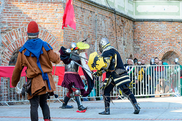 Old knights show Wroclaw, Poland - October 5, 2014: Enthusiasts of the old knights show their costumes and skills in a duel at the Cultural Center "Castle" - Lesnica in Wroclaw. bailey castle photos stock pictures, royalty-free photos & images