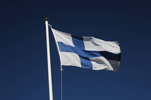 istock Finnish Flag On Dark Blue Sky 517171337