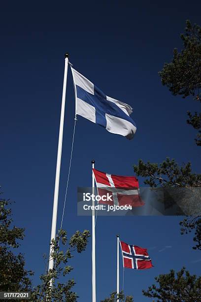 Foto de Nórdico Flags No Céu Azulescuro e mais fotos de stock de Azul - Azul, Azul escuro - Azul, Bandeira