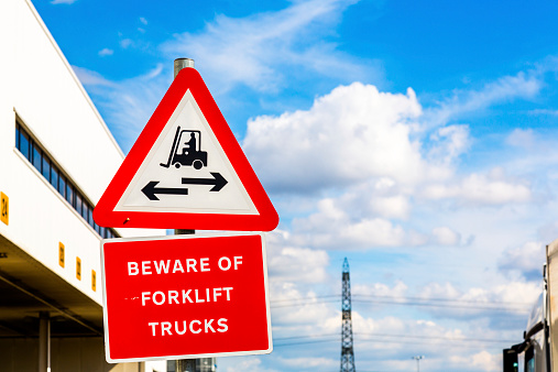 Beware of forklift sign on blue sky