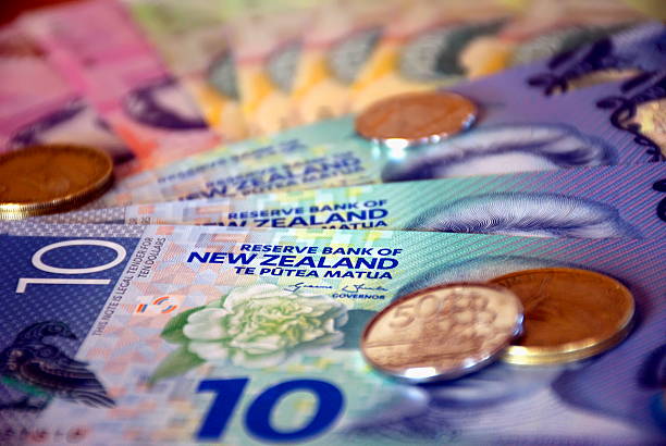 New Zealand Money (NZD); Dollars & Coins A mixture of New Zealand Bank notes and coins. new zealand dollar photos stock pictures, royalty-free photos & images