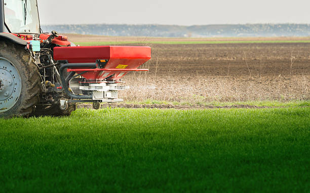istock tractor fertilizing in field 517182692