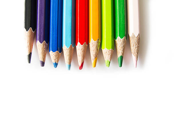 istock Colorful pencils in glass isolated on red background 517183659
