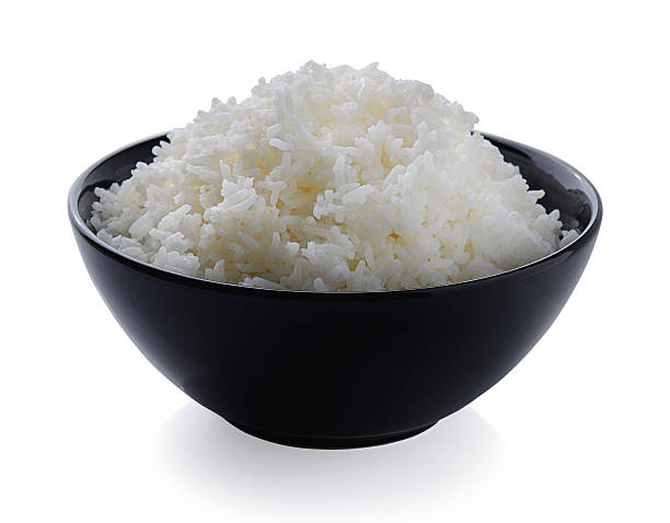 istock bowl full of rice on white background 517184167