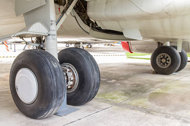 istock rear landing gear and engine passenger plane on the ground 517184975